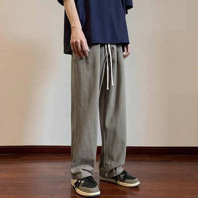 Moderné pánske nohavice s vreckami a šnúrkami rovného strihu