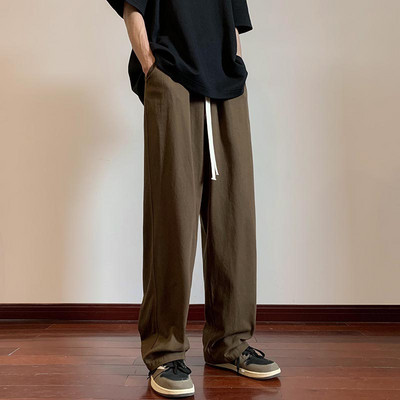 Moderné pánske nohavice s vreckami a šnúrkami rovného strihu