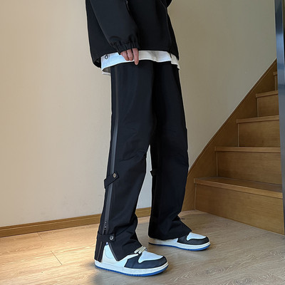 Pánske ležérne nohavice so zipsom a gombíkmi