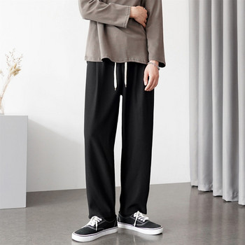 Широк модел мъжки панталон с висока талия и връзки