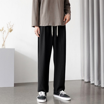 Широк модел мъжки панталон с висока талия и връзки