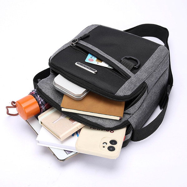 Moderna muška tekstilna torba preko ramena sa natpisom