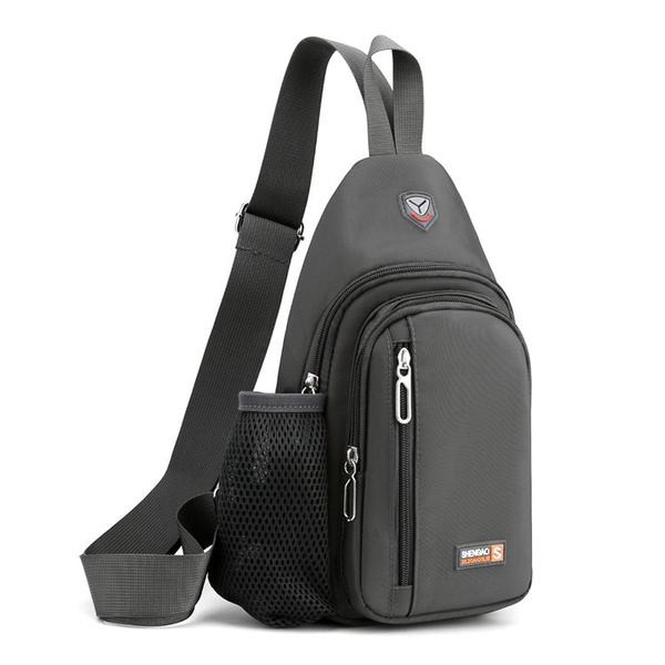 Mala tekstilna torba za rame s nekoliko pretinaca