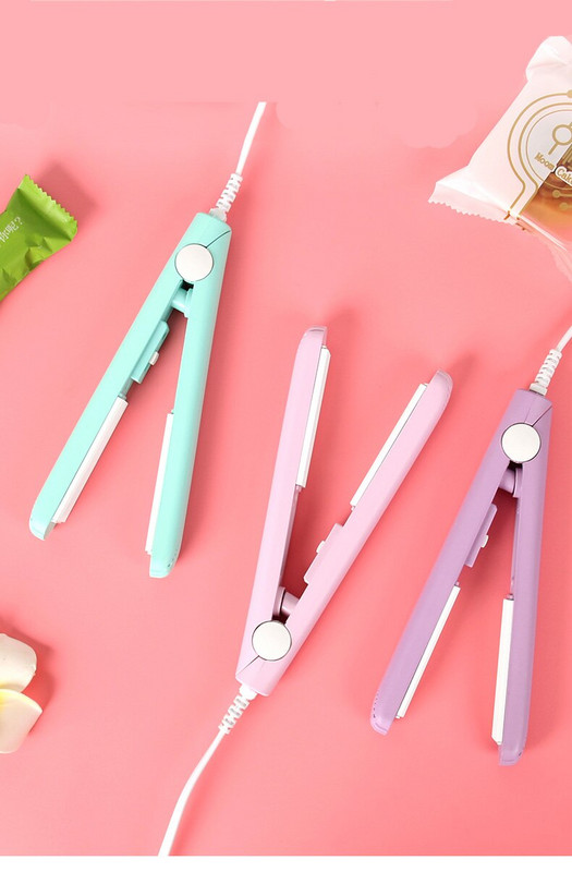 Kūrybiška buitinė maža elektrinio šildymo mini rankinio slėgio užkandžių plastikinių maišelių sandarinimo mašina