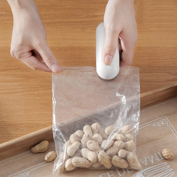 Кухненски аксесоари Мини машина за запечатване Преносим термоуплътнител Пластмасова чанта за съхранение на опаковка Удобен стикер и уплътнения за хранителна закуска