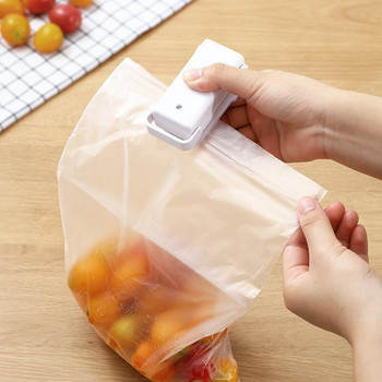 Преносим мини уплътнител Домашна топлинна торбичка Пластмасова машина за запечатване на торбички за храна Закуски Машина за запечатване на хранителни опаковки Кухненска чанта за съхранение Щипки Търговия на едро