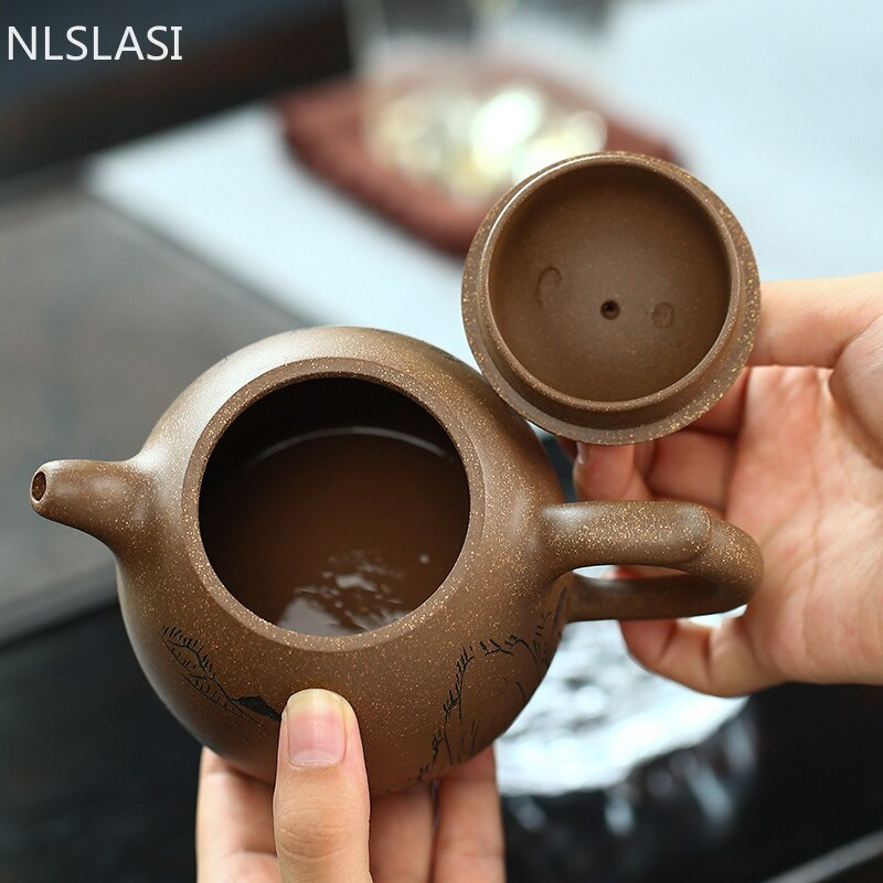 Kínai Yixing teáskanna teaszertartási kellékek Boutique Purple Clay Xishi teáskanna kézzel készített teaedény Ore Beauty Kettle Master 340 ml