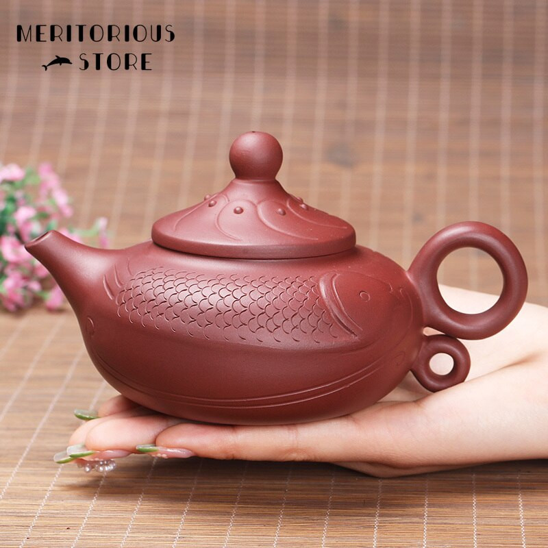 Fish Shape Yixing Purple Clay teáskanna Kínai nyers érc kézzel készített Kung Fu Zisha teás edény 340 ml Ingyenes kiszállítás Beauty vízforraló teáskészlet