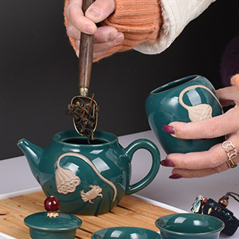 Relief Lotus Art teáscsésze Kung Fu teáskészlet ajándék háztartási hordozható kerámia tea Caddy ajándék 1 edény 4 csésze teáskészlet, utazási teáskészlet