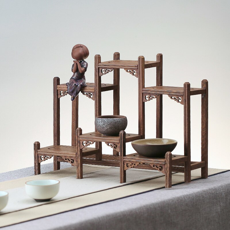 Mažas medžio masyvo, paprastas arbatos puodo laikiklis, senovinės ir įdomios lentynos vištienos sparneliai mediniai kiniško stiliaus arbatos puodo padėklas
