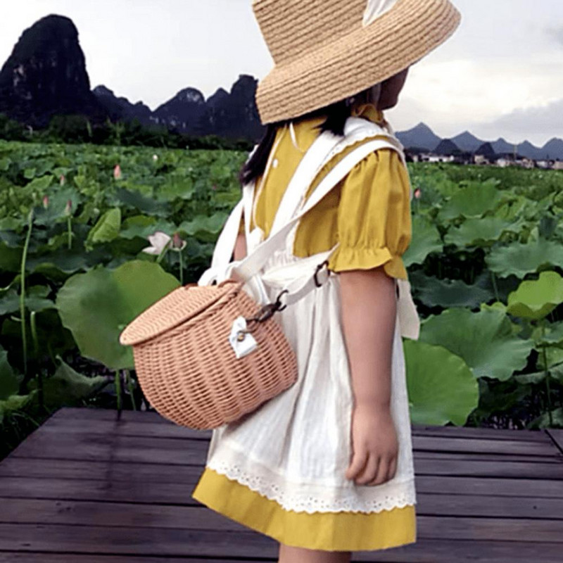 Детска малка кошница за гърба Сладка ръчно тъкана ратанова раница Бебешка кошница за съхранение на рамо Модни кошни чанти за момичета Ратан