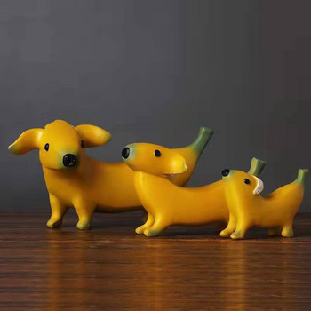 Αστείο άγαλμα σκύλου με μπανάνα Χαριτωμένα ειδώλια σκύλου με αποφλοιωμένη μπανάνα Διακοσμήσεις κήπου Διακοσμήσεις επιφάνειας εργασίας από ρητίνη Διακοσμητικά χαριτωμένα σκυλιά