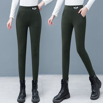 Moteriškos vienspalvės antblauzdžiai su logotipu