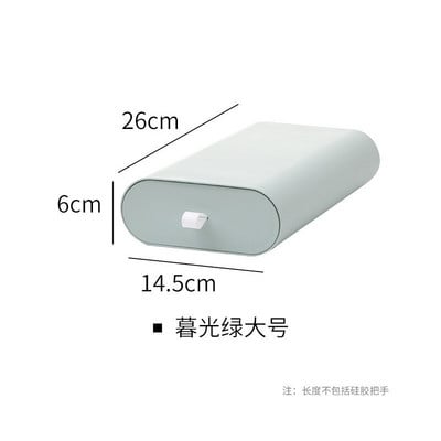 Lipnus pieštukų dėklas po rašomuoju stalčiumi.