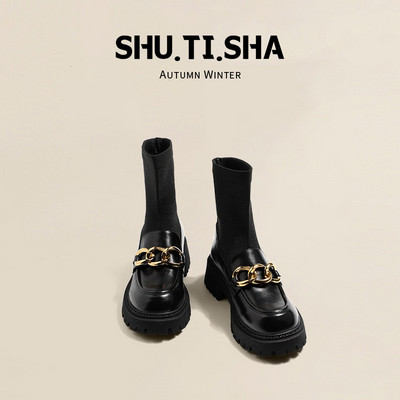 Női zokni típusú csizma sarokkal és fém elemekkel