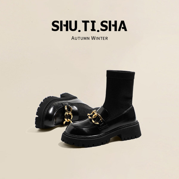 Női zokni típusú csizma sarokkal és fém elemekkel