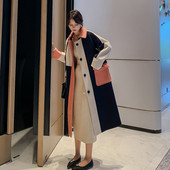 Ilgas moteriškas paltas su sagomis ir kišene