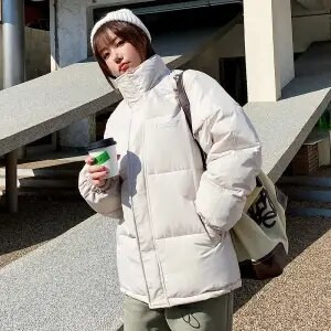 2022. gada jauns ziemas kapuci ar garām piedurknēm vienkrāsains, melns, polsterēts ar kokvilnu, silts, brīvs liela izmēra jaka Sieviešu Parkas Modes virsdrēbes