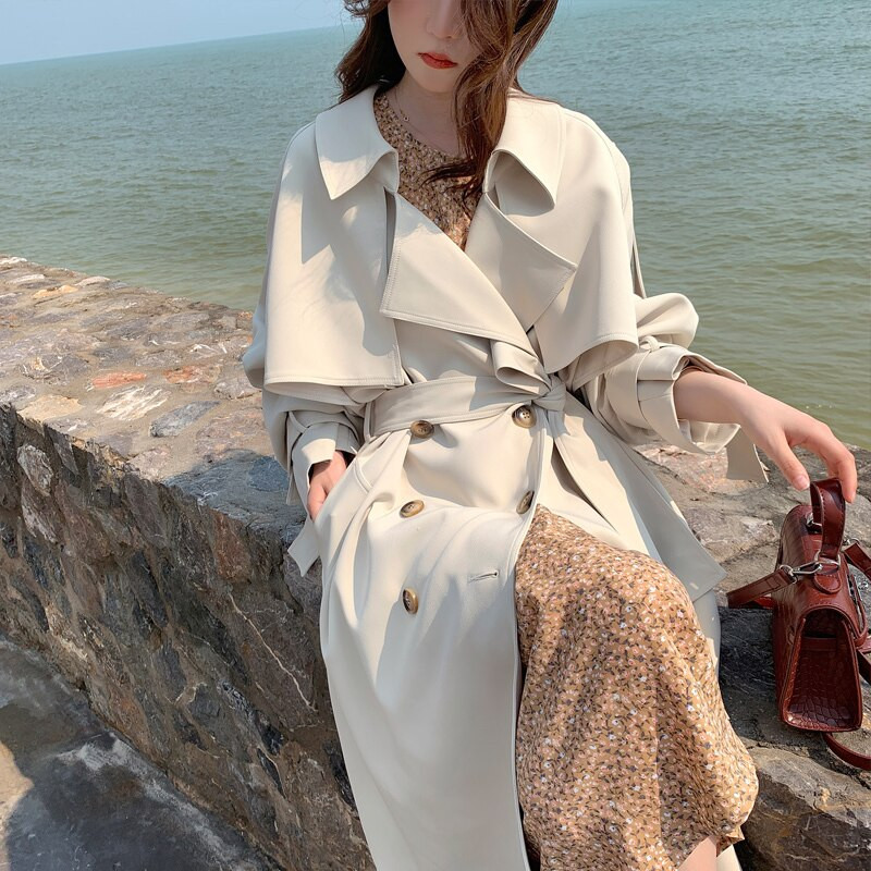 Augstas kvalitātes jostas vidēja garuma smilškrāsas Trench Jaka Sieviešu Ikdienas Retro Plats Atloks Garām Piedurknēm Vējjaka Sieviešu Rudens Jaunums