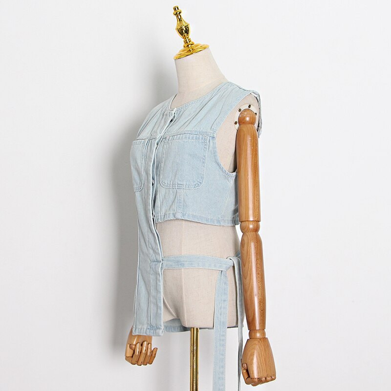 TWOTWINSTYLE Lace Up Bowknot džinsa veste sievietēm O kakla bez piedurknēm, dobas ikdienas vestes Sieviešu modes jauns apģērbs 2021