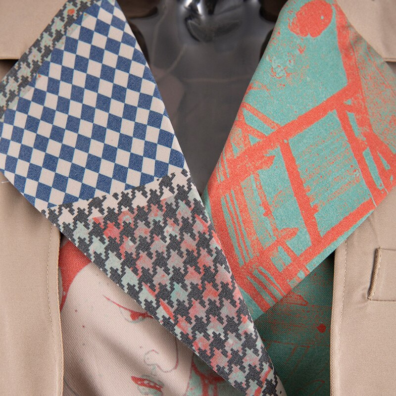 2021 Φθινοπωρινές γυναικείες καμπαρντίνες Σχεδιαστής μόδας Ζώνη με στάμπα συνονθύλευμα μακριά καμπαρντίνα Γυναικεία ασυμμετρία Κομψό λεπτό αντιανεμικό